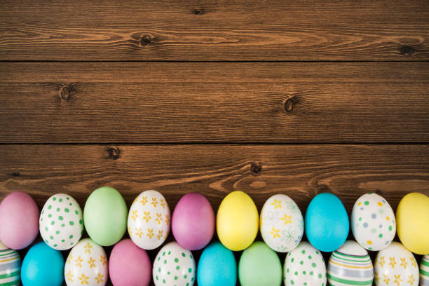 istock Easter Eggs on Brown Wooden Background 658584618
