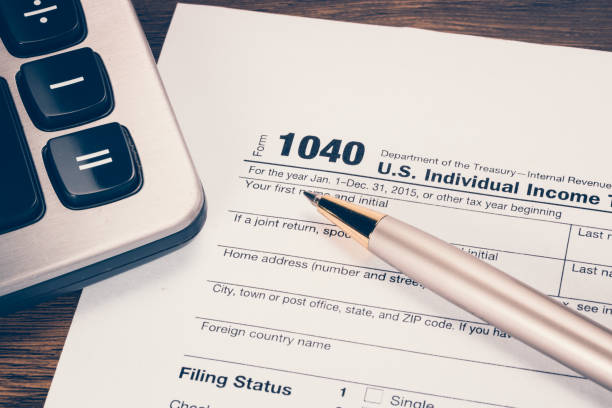 istock U.S. tax form 1040 with pen 658588102