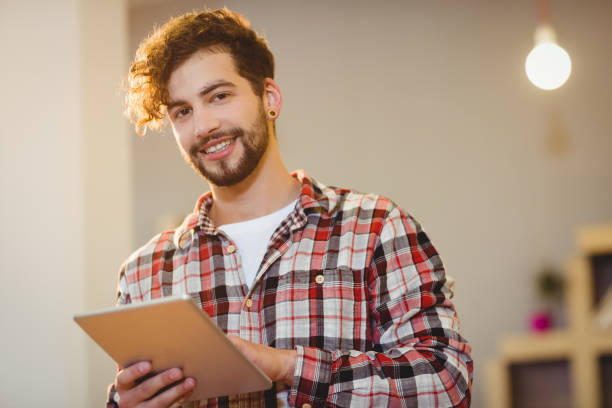 istock Portrait of graphic designer using digital tablet 658595944