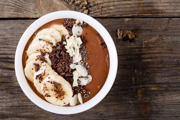 istock Chocolate smoothie bowl with banana, chia seeds and almond chips 658596012