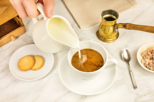 istock Milk poured into cup of coffee 658596148