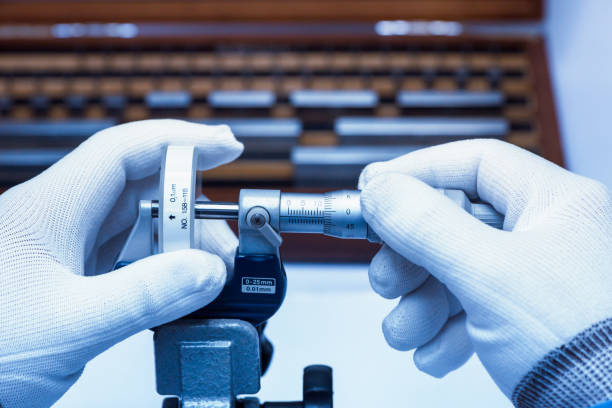 Micrometer Calibration with gauge block in laboratory. Micrometer Calibration with gauge block in laboratory. micron stock pictures, royalty-free photos & images