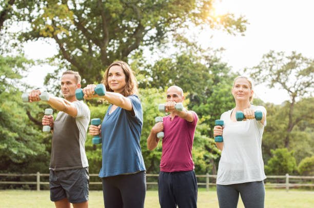 istock Mature people exercise at park 658599186