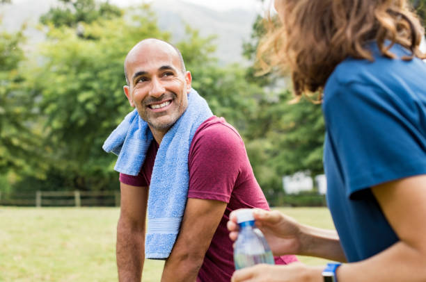 man relaxing after workout - old senior adult women tired imagens e fotografias de stock