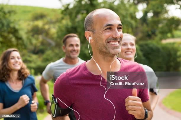 Happy People Running Stock Photo - Download Image Now - Exercising, Running, Group Of People