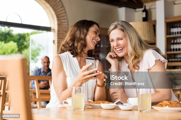 Laughing Mature Friends Stock Photo - Download Image Now - Women, Friendship, Only Women