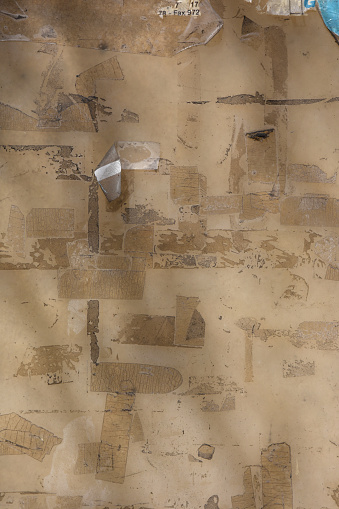 remains of adhesive tape on a wall