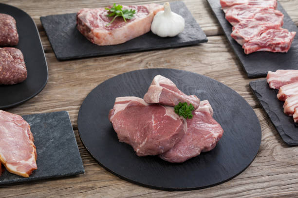 istock Varieties of meat on black tray 658605546