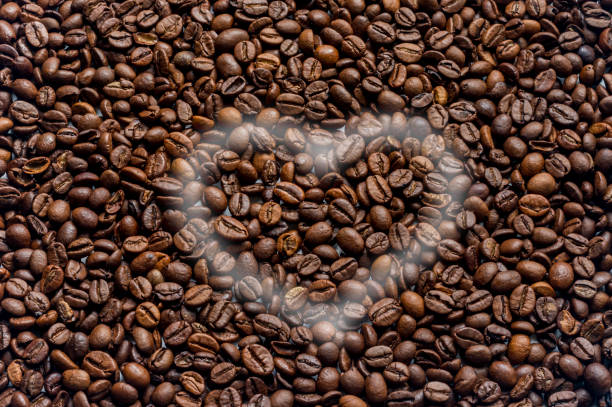 istock coffee beans texture background with smoke heart 658609752