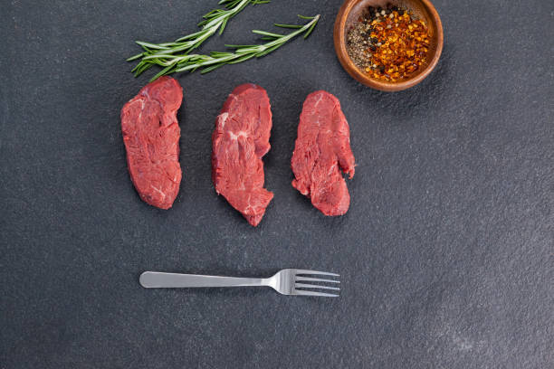 istock Beef steak, rosemary herb and spices 658610230