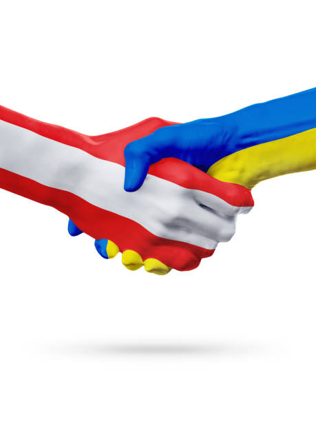 istock Flags Austria, Ukraine countries, partnership friendship handshake concept. 658610782