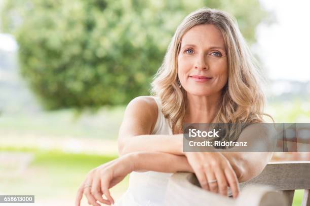 Senior Woman Relaxing Stock Photo - Download Image Now - Women, One Woman Only, Mature Women