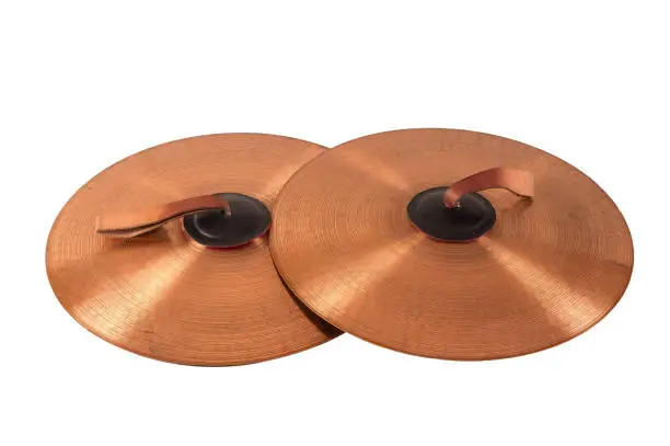 Close up of an prcussion cymbals with leather handle  isolated on background.