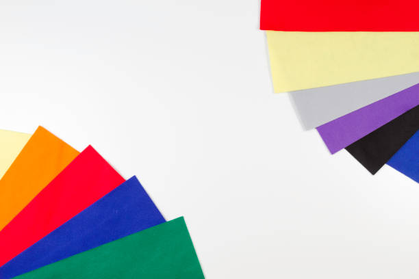 istock Selection of colorful felt sheets arranged as border frame on white background 658614114