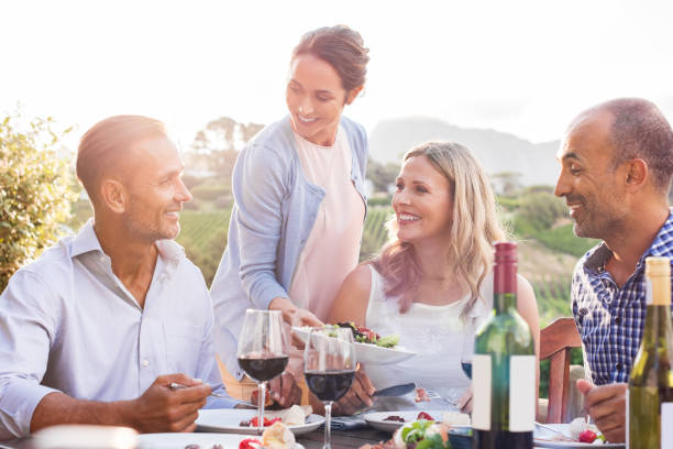 istock Mature couples eating outdoors 658616630