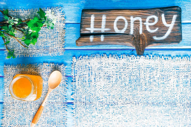 istock Spring painted wood background with honey 658616782