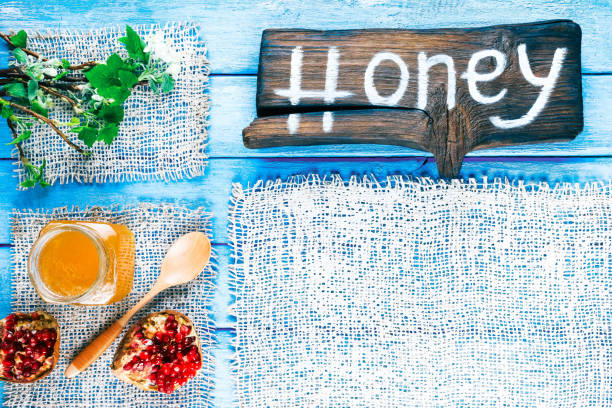 istock Spring painted wood background with honey 658616806
