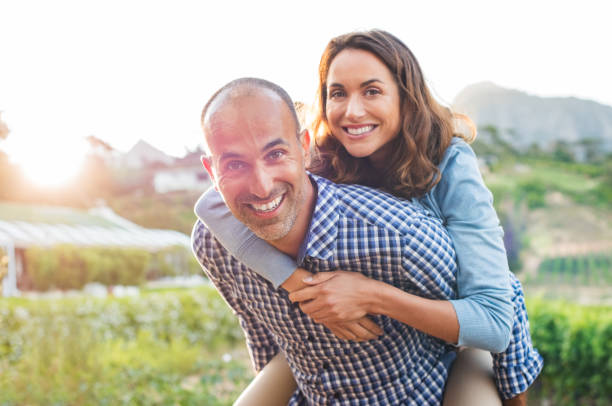 istock Piggyback mature couple 658617084