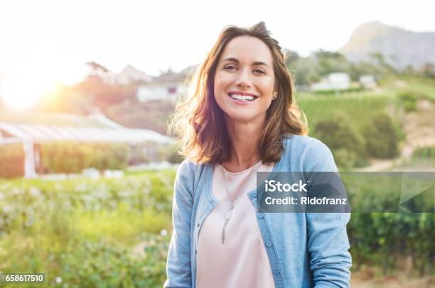 Laughing Woman In Park Stock Photo - Download Image Now - Women, One Woman Only, Outdoors