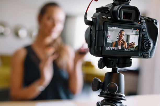 istock Young female vlogger recording a make-up video for her vlog. 658621130