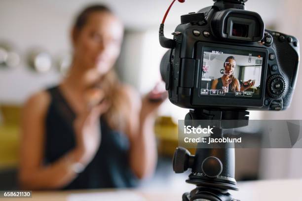 Young Female Vlogger Recording A Makeup Video For Her Vlog Stock Photo - Download Image Now