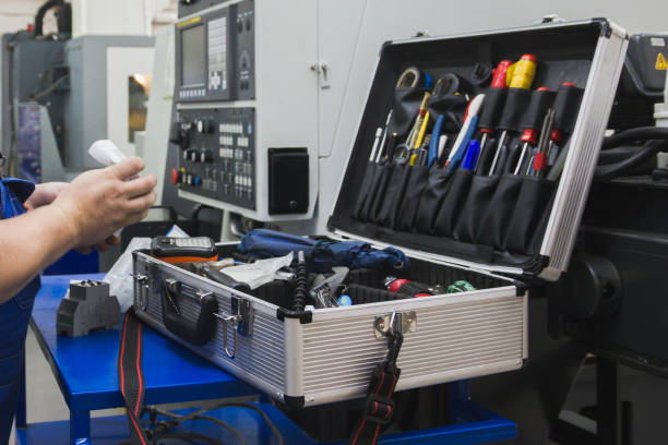 istock Worker in industry holding set of tools for repair - screwdriver, voltmeter, wrenches 658622098