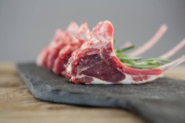 istock Rib chops and rosemary herb on slate board 658628020