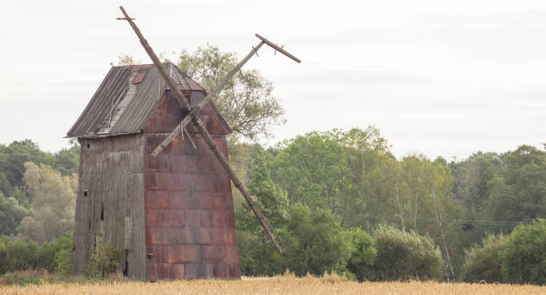 istock Kawnice, Poland. Old ruined windmill on the field. 658635248