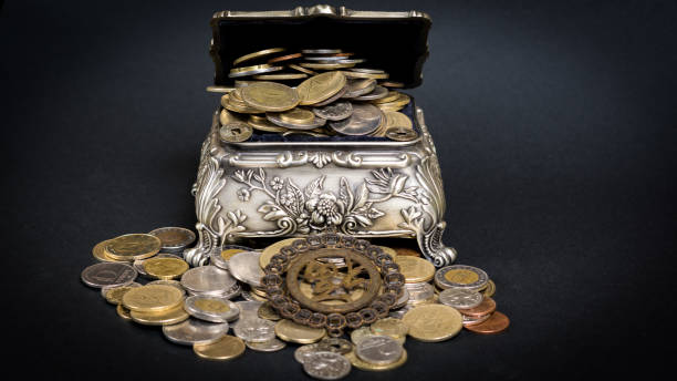 istock Treasure chest filled up with coins 658638590