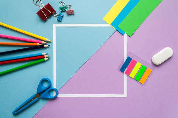 istock square frame with stationery on blue and violet background. flat lay. 658638884