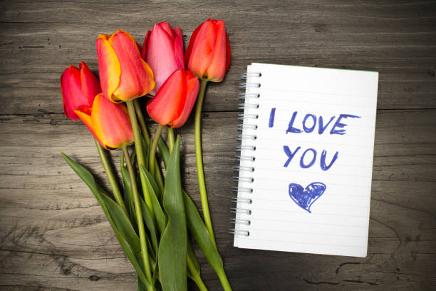 istock tulip bouquet and notepad with words 