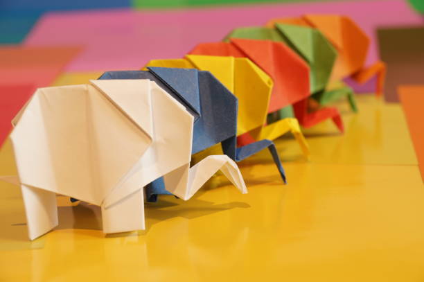 istock Paper origami elephant is isolated on colorful background 658643522