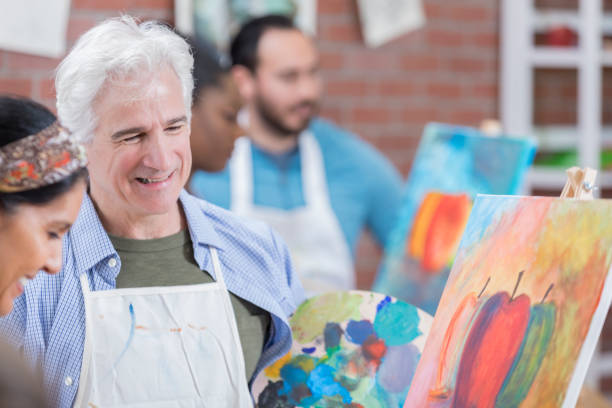istock Cheerful adult art students 658645938