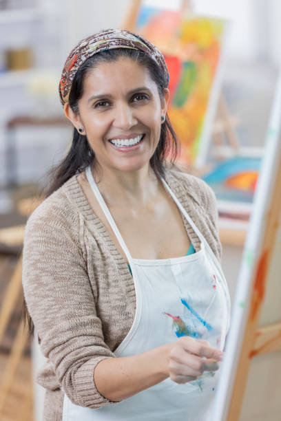 istock Beautiful artist in her studio 658645960