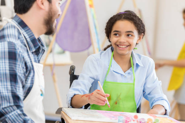 istock Confident young artist paints on a canvas 658646256