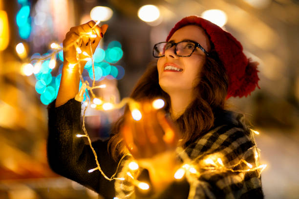 istock Woman decorated with lights like Christmas tree 658654768