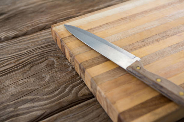 istock Knife on wooden tray 658657338