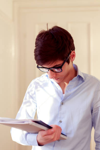 Student holds a book stock photo