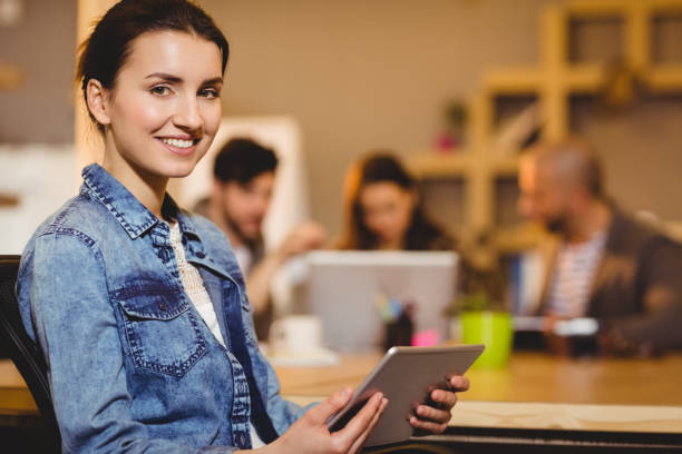 istock Female graphic designer holding digital tablet 658661432