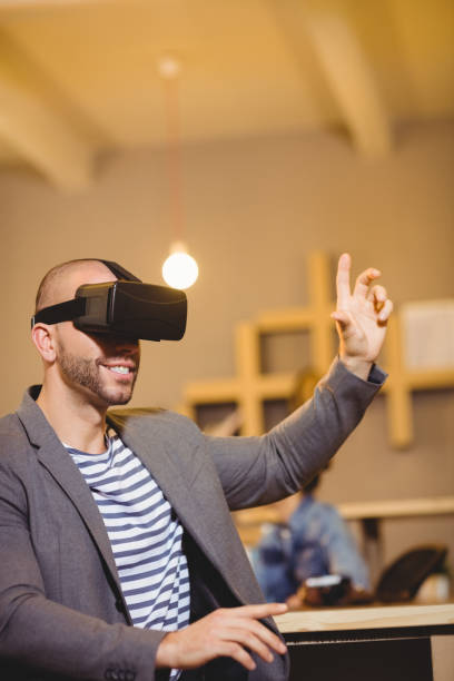istock Male graphic designer wearing virtual glasses 658662256