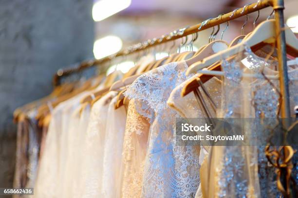 A Few Beautiful Wedding Dresses On A Hanger Stock Photo - Download Image Now - Dress, Wedding Dress, Luxury
