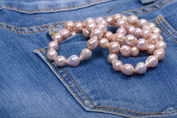 Jeans and Pearl Necklace stock photo