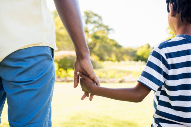 istock Focus on hands of son and father 658676040