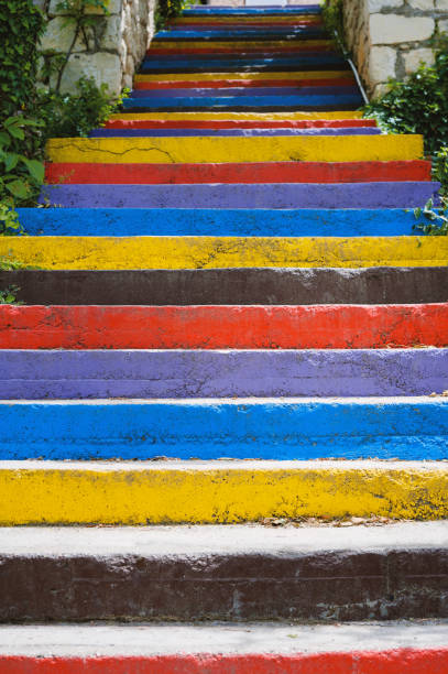 escalera pintada en fondo de colores del arco iris - staircase steps istanbul turkey fotografías e imágenes de stock