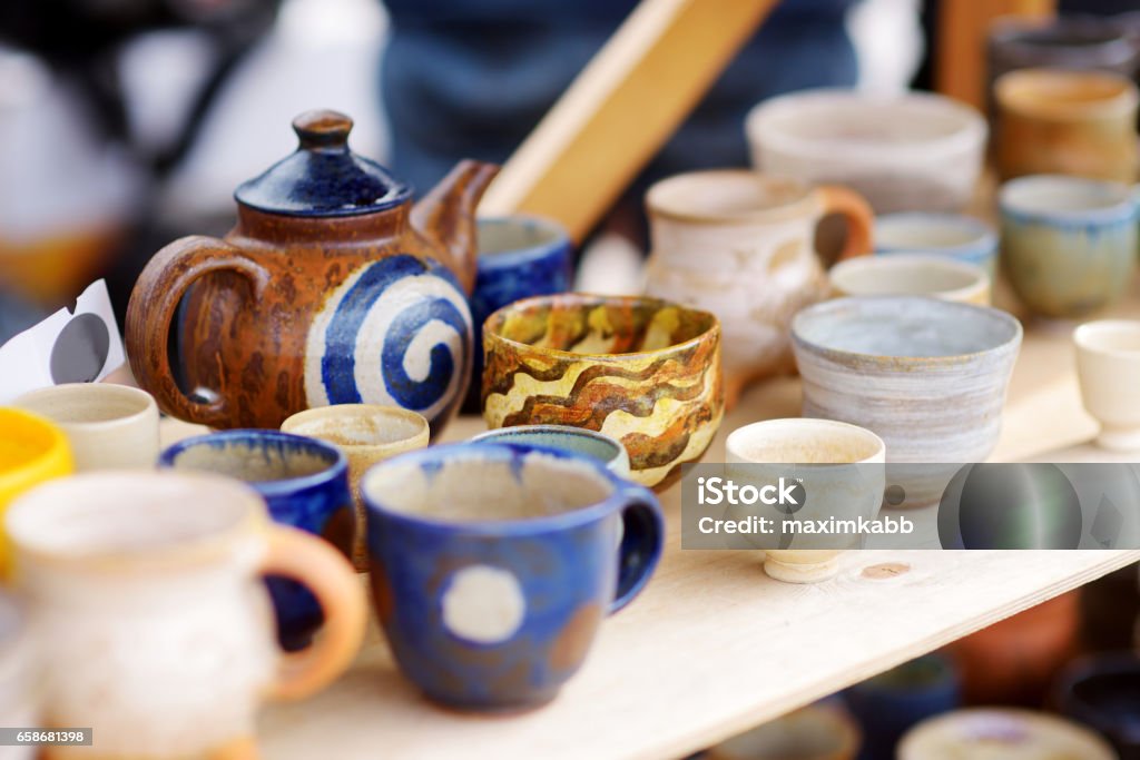 Ceramic dishes, tableware and jugs sold on Easter market in Vilnius, Lithuania Ceramic dishes, tableware and jugs sold on Easter market in Vilnius. Lithuanian capital's annual traditional crafts fair is held every March on Old Town streets. Art Stock Photo