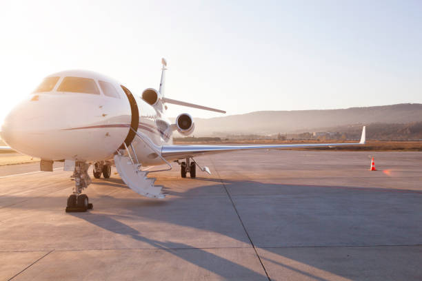 Private Jet On Airport Runway Private Jet On Airport Runway military private stock pictures, royalty-free photos & images