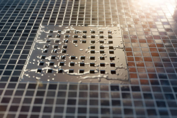 water drops on metal gutter in the evening sunshine - heat sink imagens e fotografias de stock