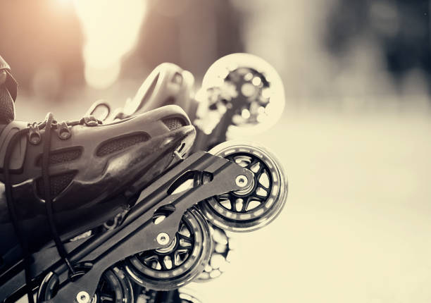Wheels of roller skates closeup in the rays of the sun.