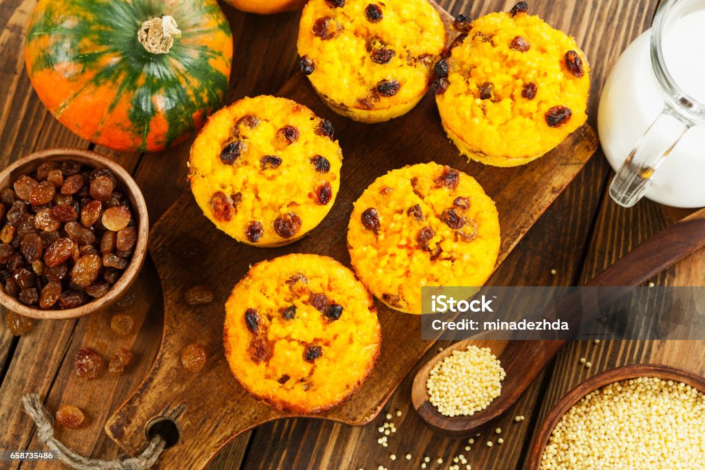 Pumpkin cake with  millet Pumpkin cake with  millet and raisin on the wooden table Acorn Squash Stock Photo