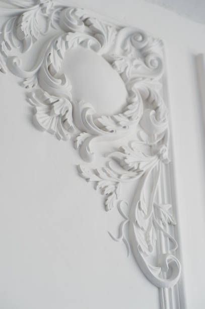 istock White wall molding with geometric shape and vanishing point. Luxury white wall design bas-relief with stucco mouldings roccoco element 658744778